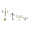 Vintage brass 3-prong candelabras with varied heights and patina finishes, styled for event tablescape