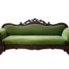 Belle Sofa in hunter green velvet with dark ornate carved wood frame, front view on white background