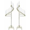 Two gold spiral floor length candelabras.