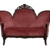 Duchess Settee - antique deep pink velveteen settee with carved dark wood trim for rent in Indianapolis