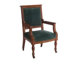 Blythe Chair in hunter green velvet with ornate carved dark wood frame and caster legs, front view