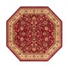 Octagon shaped maroon rug with flower design