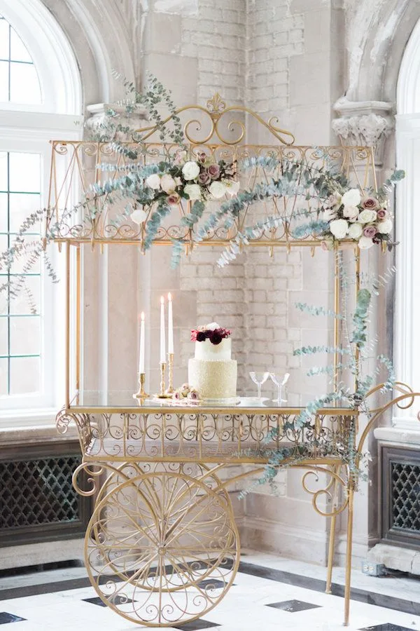 Montmonte Display Cart WEBP Our gold display cart with a cake and florals