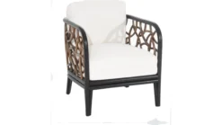 Trini Chair — boho-modern rattan accent chair with interlocking woven circular panels, curved black frame, and white cushions