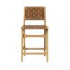 Bar stool with light wood legs and frame and leather seat and back