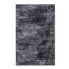 Dark gray area rug with a distressed medallion in white in the middle