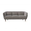 Gray velvet modern sofa with three pillows and cushions. Brown wooden legs