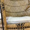 Close up on rattan peacock chair showing black geometric details within the rattan seat edging.