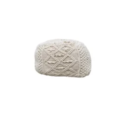 Ivory macrame pouf with geometric designs.