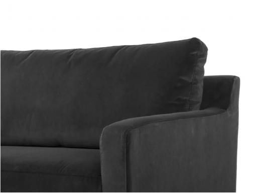 Close up of a solid dark gray sofa - showing half of the sofa - one solid cushion and a thin curved arm