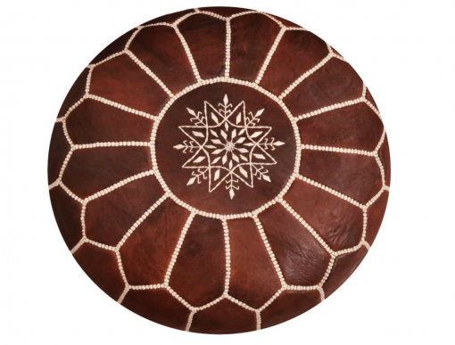 Brown leather ottoman with white detailing. Top view shows a medallion in the middle with spokes radiating around it to create a symmetrical design