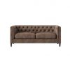 Modern brown leather sofa with a slightly distressed look. Tufted back