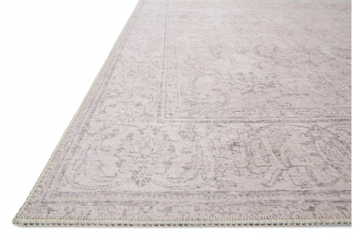 Close up of rug - tan with faded design details