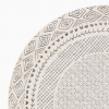 Round cream rug with gray detailing - diamonds for the border, tiny hearts, and lines.