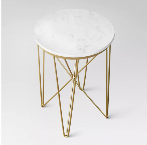 View of Juno side table from a higher view - showcasing the white marble table top and gold criss-crossed legs