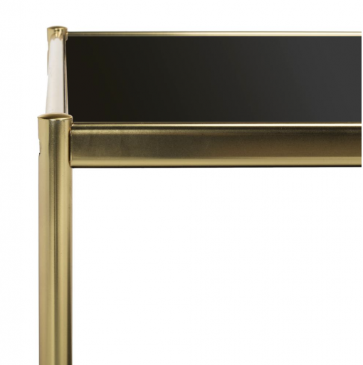 Two tier rectangular coffee table with gold metal frame and black glass shelf, side view