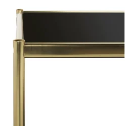 Two tier rectangular coffee table with gold metal frame and black glass shelf, side view