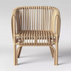 Front view of rattan chair - vertical cane in a neutral wood color