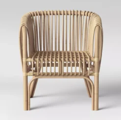Front view of rattan chair - vertical cane in a neutral wood color