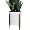 Fake Snake Plant in a white planter with black legs