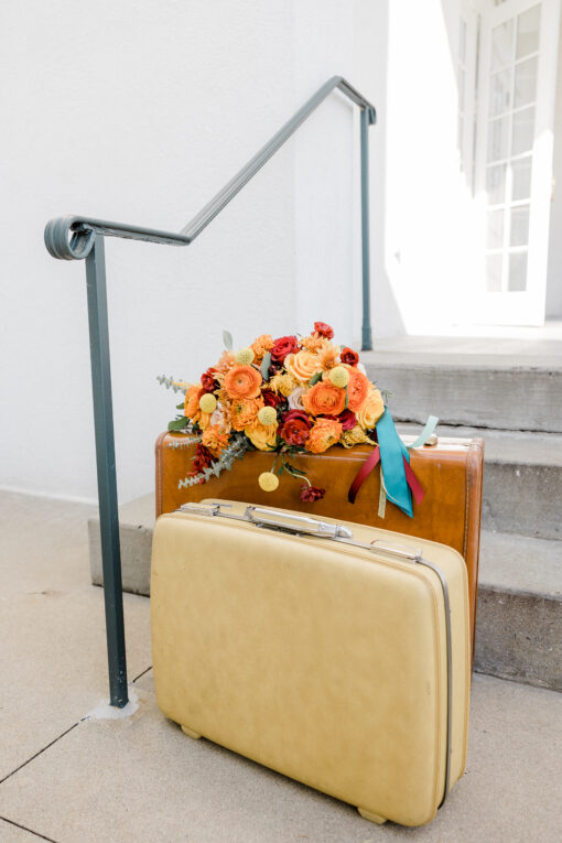 Two vintage suitcases with florals