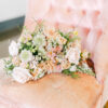 Velvet pink chair with no arms with a floral bouquet