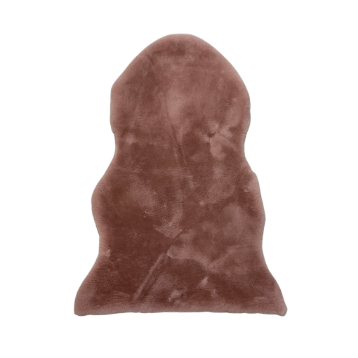 Dusty pink faux sheepskin rug. High pile in the shape of sheep skin