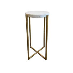 Tall and skinny side table with round white marble top and gold clean lines for the legs coming to an X at the bottom.