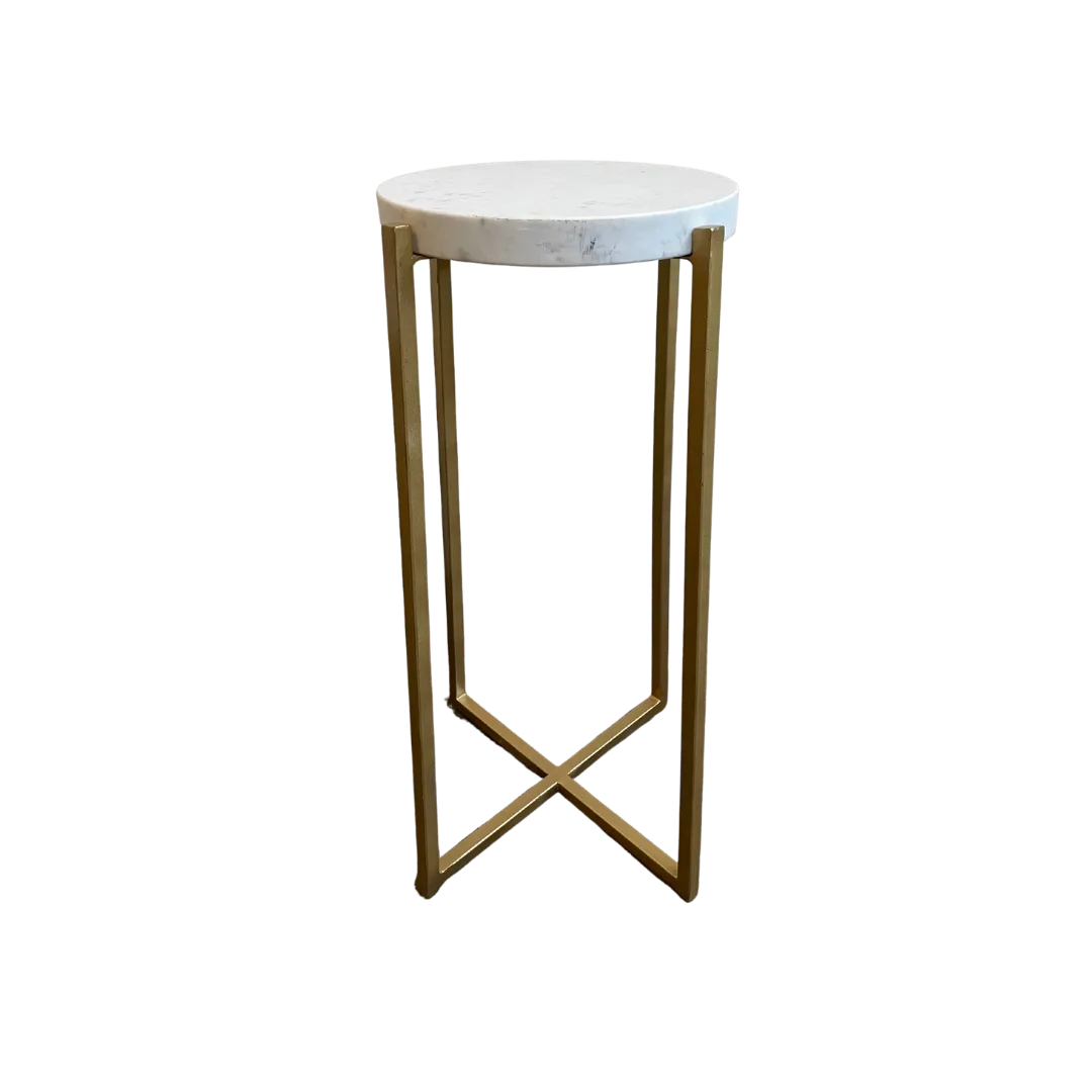 Blair Tall Side Table WEBP Tall and skinny side table with round white marble top and gold clean lines for the legs coming to an X at the bottom.