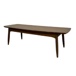 Side angle of brown rectangular coffee table with round edges. Thick lip under the top.