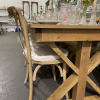 Our vineyard chairs paired with these farm tables - matching stains! View of the side end of the table with fancy legs.