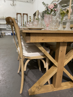 Our vineyard chairs paired with these farm tables - matching stains! View of the side end of the table with fancy legs.