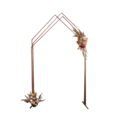 Three copper pipes attached to solid legs on the bottom and meeting at the top in an angle.