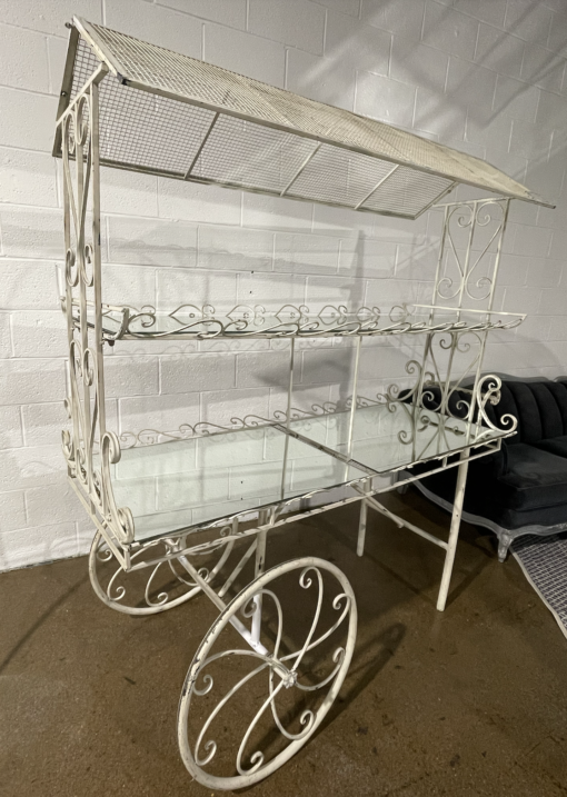 White cart with two tiers and mirrored shelves.