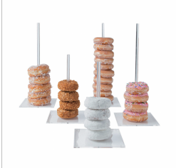 5 clear acrylic donut stands of various heights. Photo is of the stands in use with donuts.