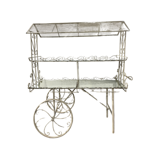 Antique White metal display cart with two mirrored shelves. Wheels on one side.