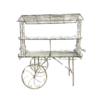Antique White metal display cart with two mirrored shelves. Wheels on one side.