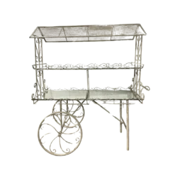Antique White metal display cart with two mirrored shelves. Wheels on one side.