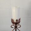 Top of the candle can hold up to a 3 inch pillar candle. Ornate design around the base.