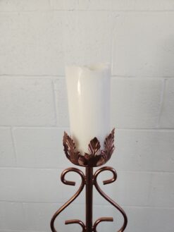 Top of the candle can hold up to a 3 inch pillar candle. Ornate design around the base.