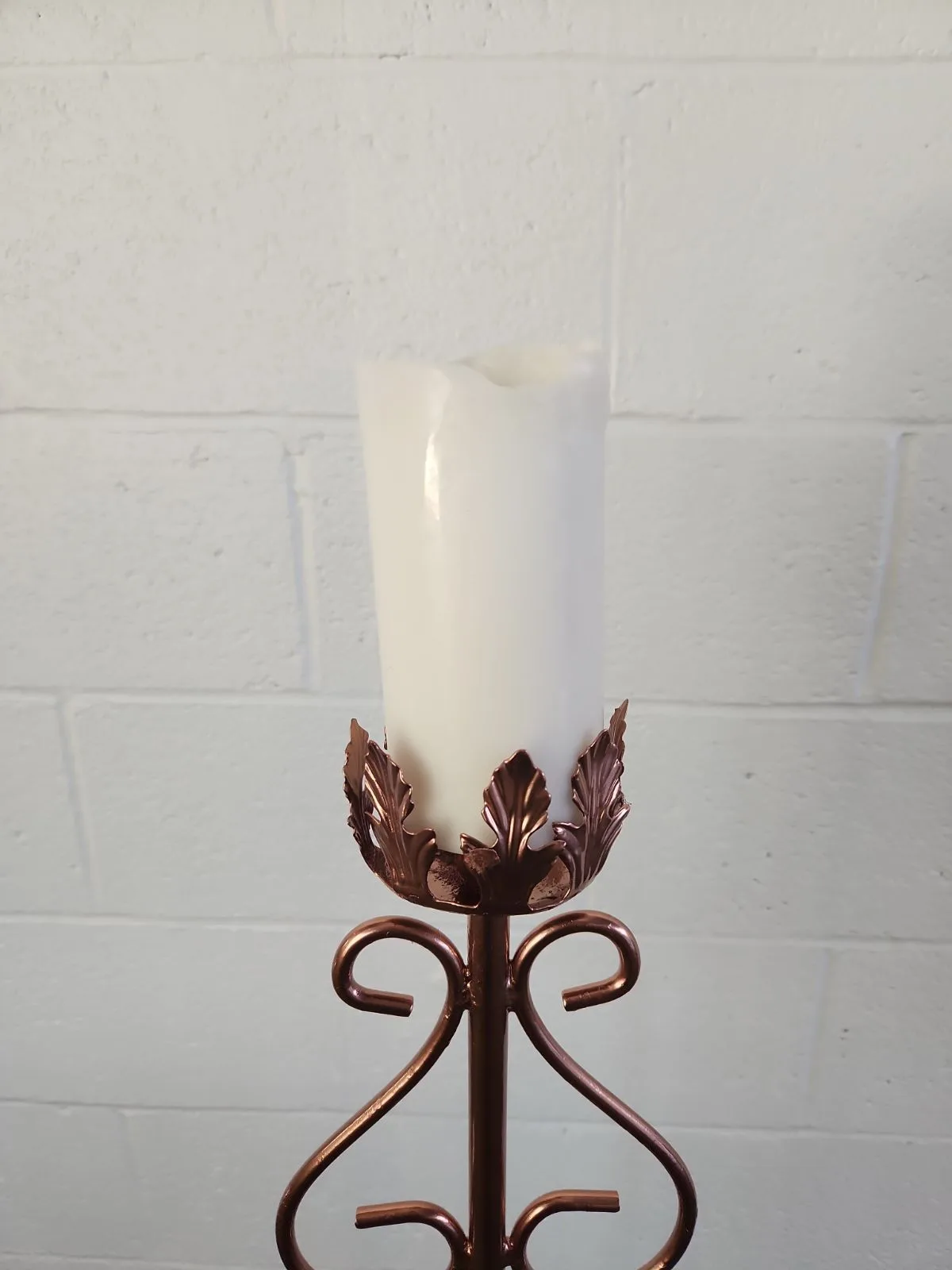 Floor candle with pillar candle WEBP Top of the candle can hold up to a 3 inch pillar candle. Ornate design around the base.