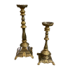 Giant gold candlesticks in various sizes. Thick base with legs, ornate stick and wide top to hold a pillar candle.