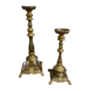 Giant gold candlesticks in various sizes. Thick base with legs, ornate stick and wide top to hold a pillar candle.
