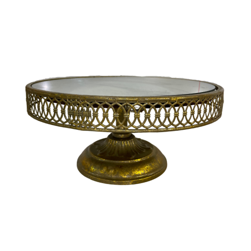 Round cake gold stand with a lattice edge and a mirror top.