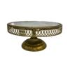 Round cake gold stand with a lattice edge and a mirror top.