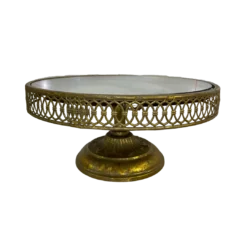 Round cake gold stand with a lattice edge and a mirror top.