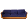 Sofa without pillows. All purple on the seating area and tan on the edge.