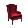 Deep red velvet arm chair with curved top and curved wooden legs.