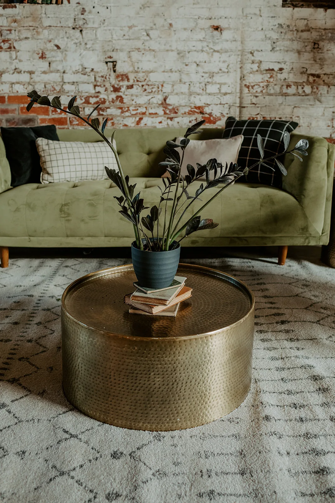 coffee table rental used in a lounge WEBP gold drum low coffee table with plant