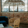 Decorative umbrella against an industrial window